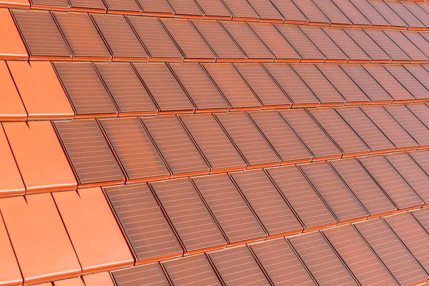 Surface covered with Stylist-PV solar roof tiles in red-brown